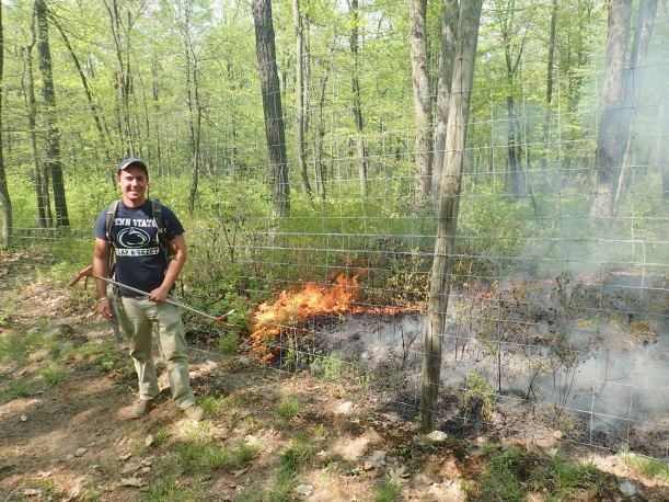 Mark Herr posing with the fire